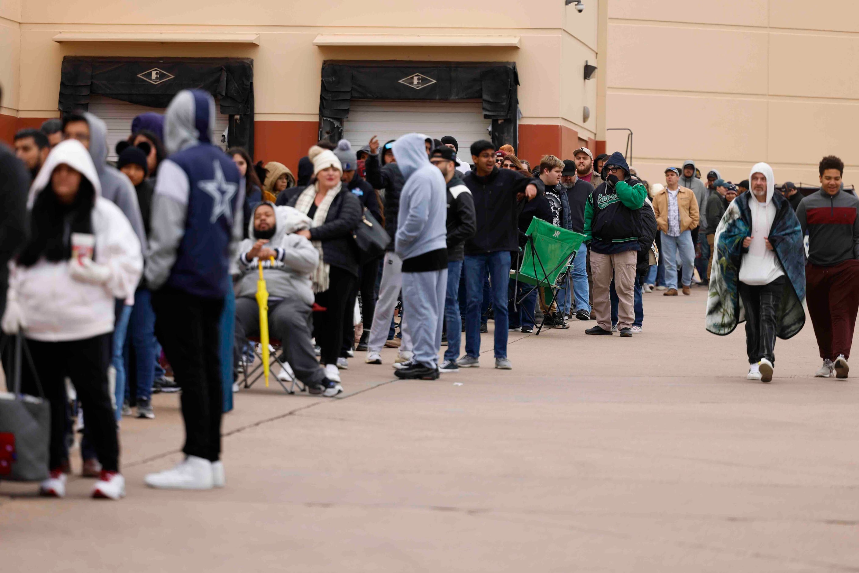 Hundreds of people wait in line to get a glimpse of actors Bryan Cranston and Aaron Paul...