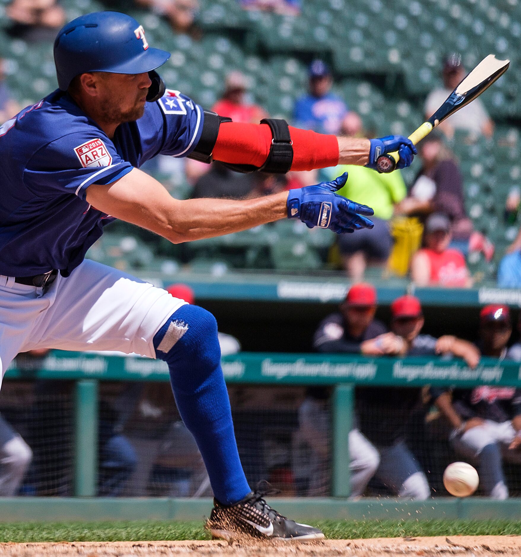 Texas Rangers outfielder Hunter Pence breaks his bat as he fouls off a pitch during the...