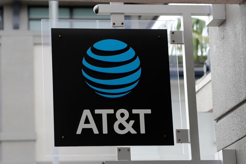 In this Thursday, July 18, 2019 photo, is an AT&T retail store in Miami. (AP Photo/Lynne...