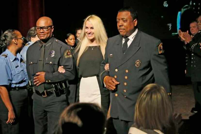 
Dallas Police Chief David Brown (left) and Fire Chief Louie Bright III escorted Kaitlin...