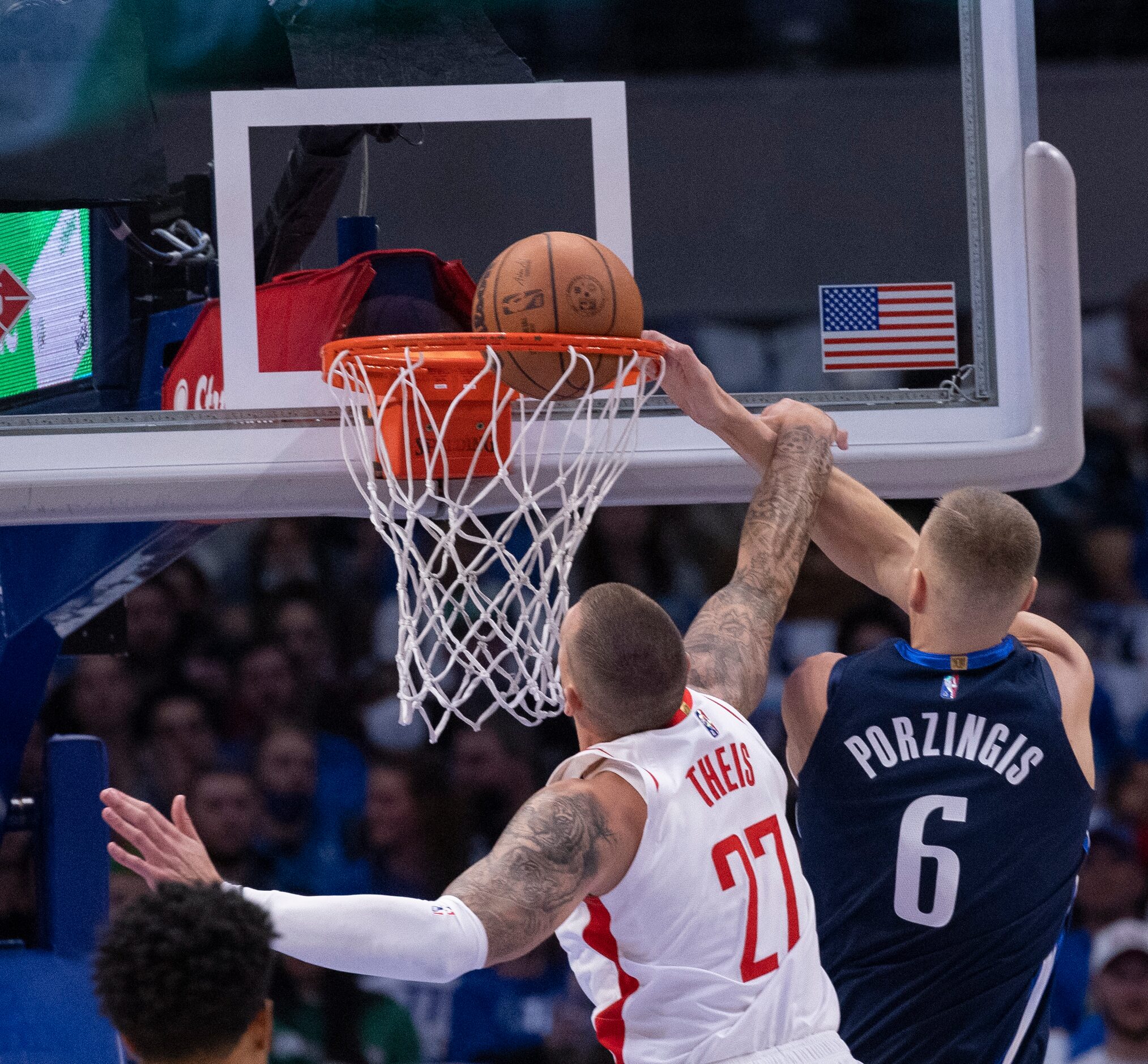 Dallas Mavericks center Kristaps Porzingis (6) scores against Houston Rockets center Daniel...