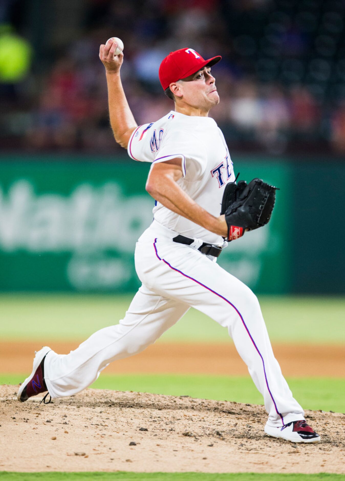 Texas Rangers relief pitcher Matt Moore (55) pitches during the seventh inning of an MLB...