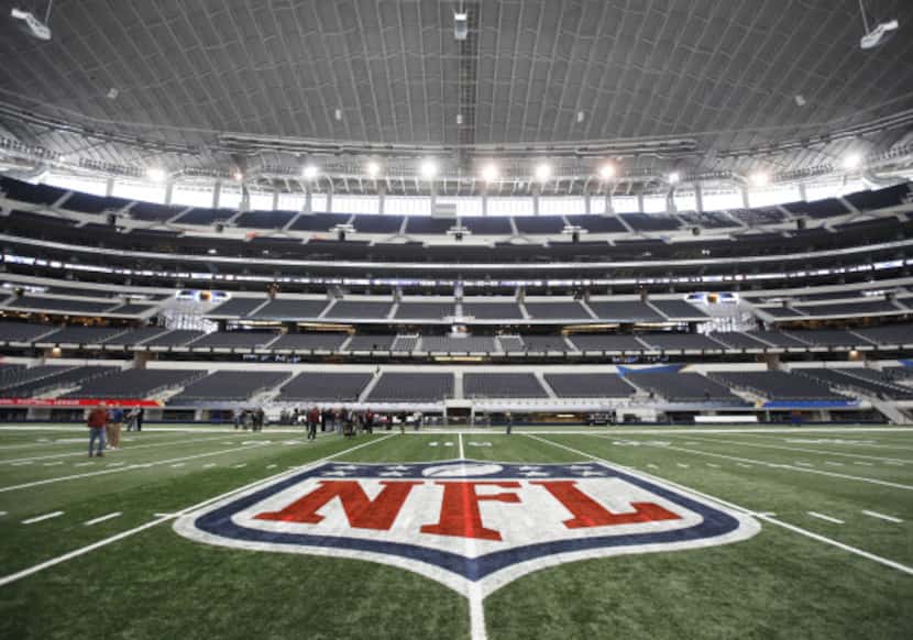 The NFL logo, painted at midfield on Jan.  27, 2011, at Cowboys Stadium in Arlington.