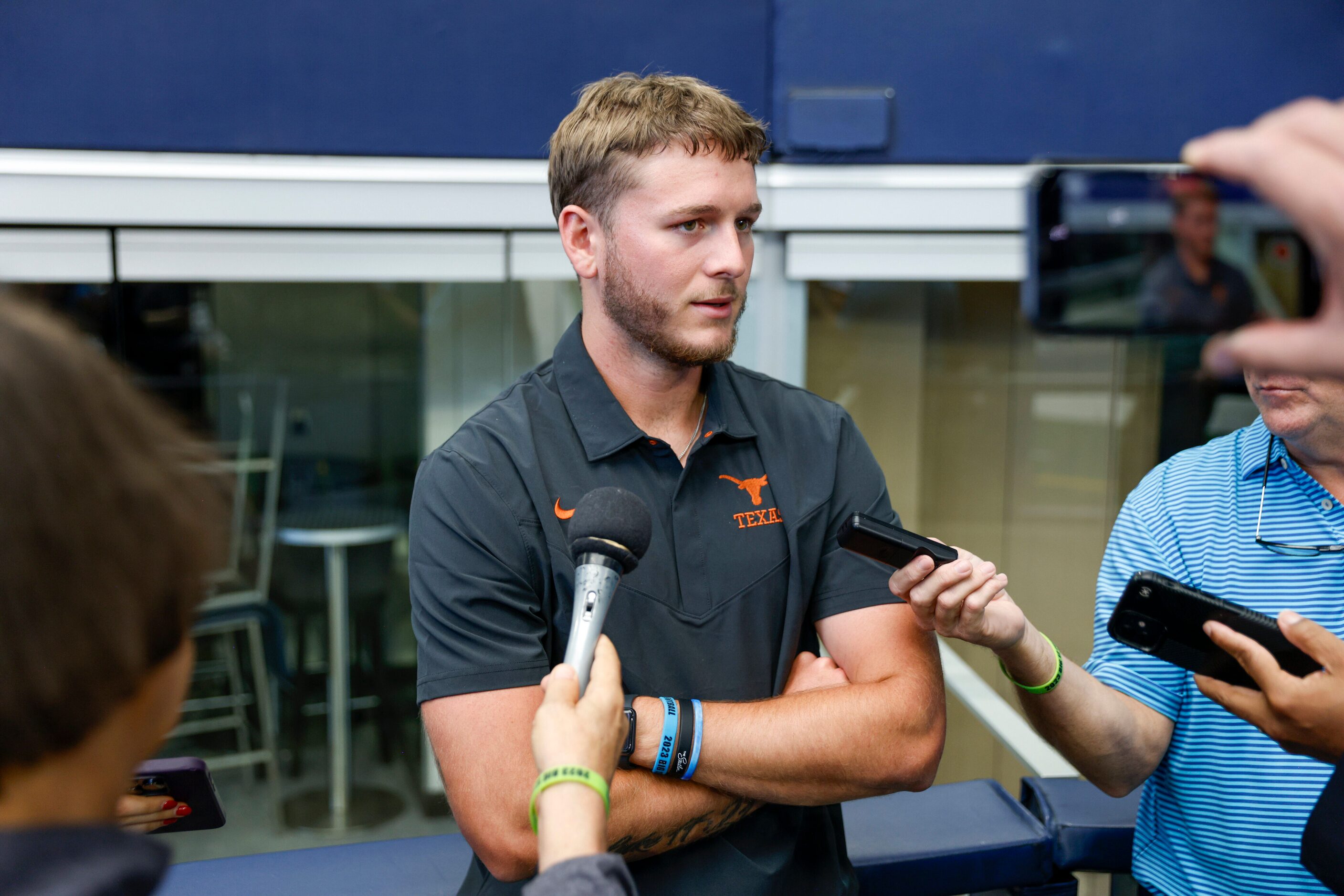 Texas quarterback Quinn Ewers speaks with reporters during the Big 12 Media Days at AT&T...