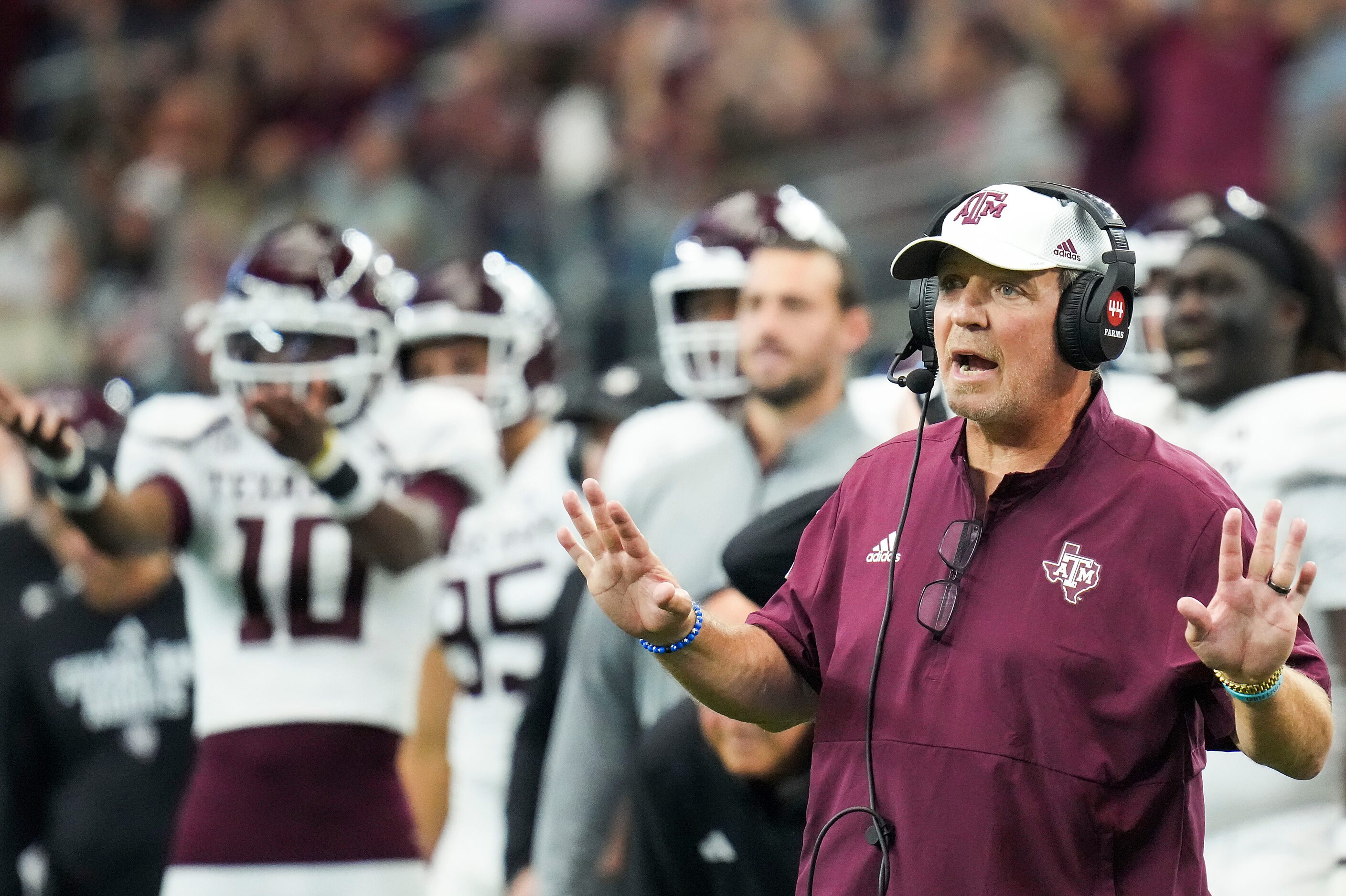 Texas A&M head coach Jimbo Fisher motions to his team during the second half of an NCAA...