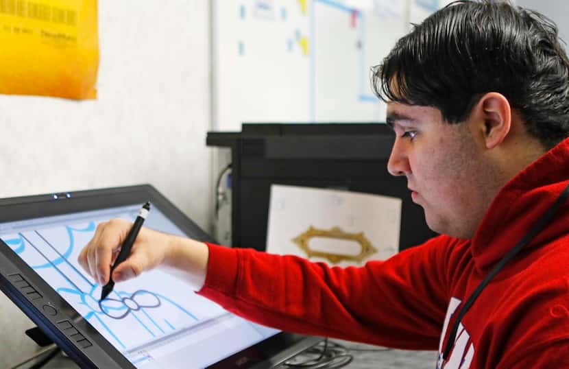 
Allen High School animation student Marco Diaz works on a project in class at Allen High...