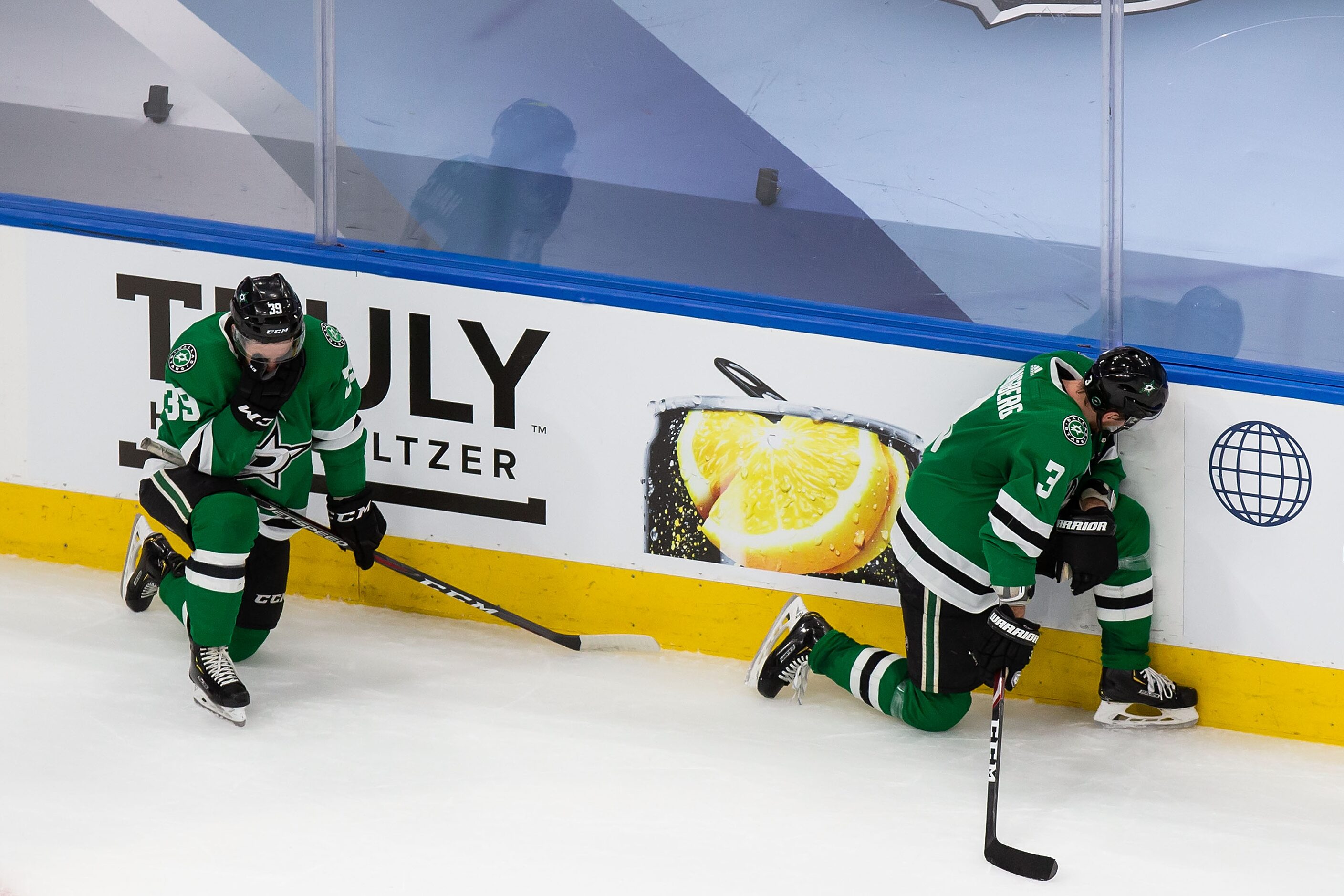 Joel Hanley (39) and John Klingberg (3) of the Dallas Stars react to their loss against the...