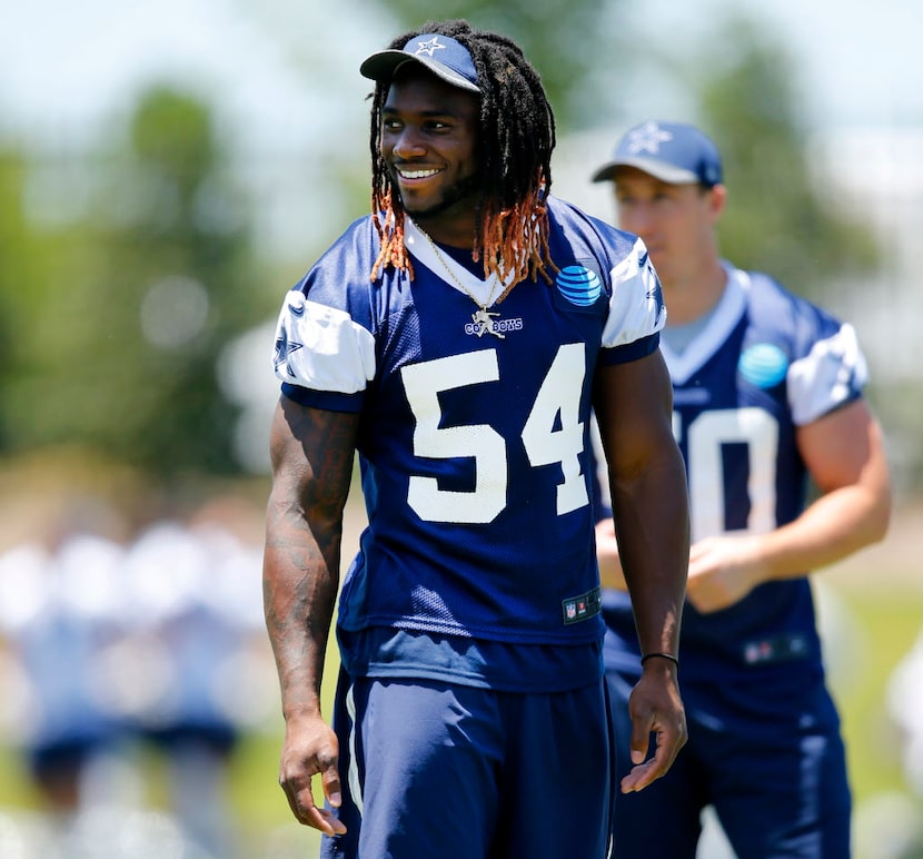 Dallas Cowboys linebacker Jaylon Smith (54) flashes a smile during the end of organized team...