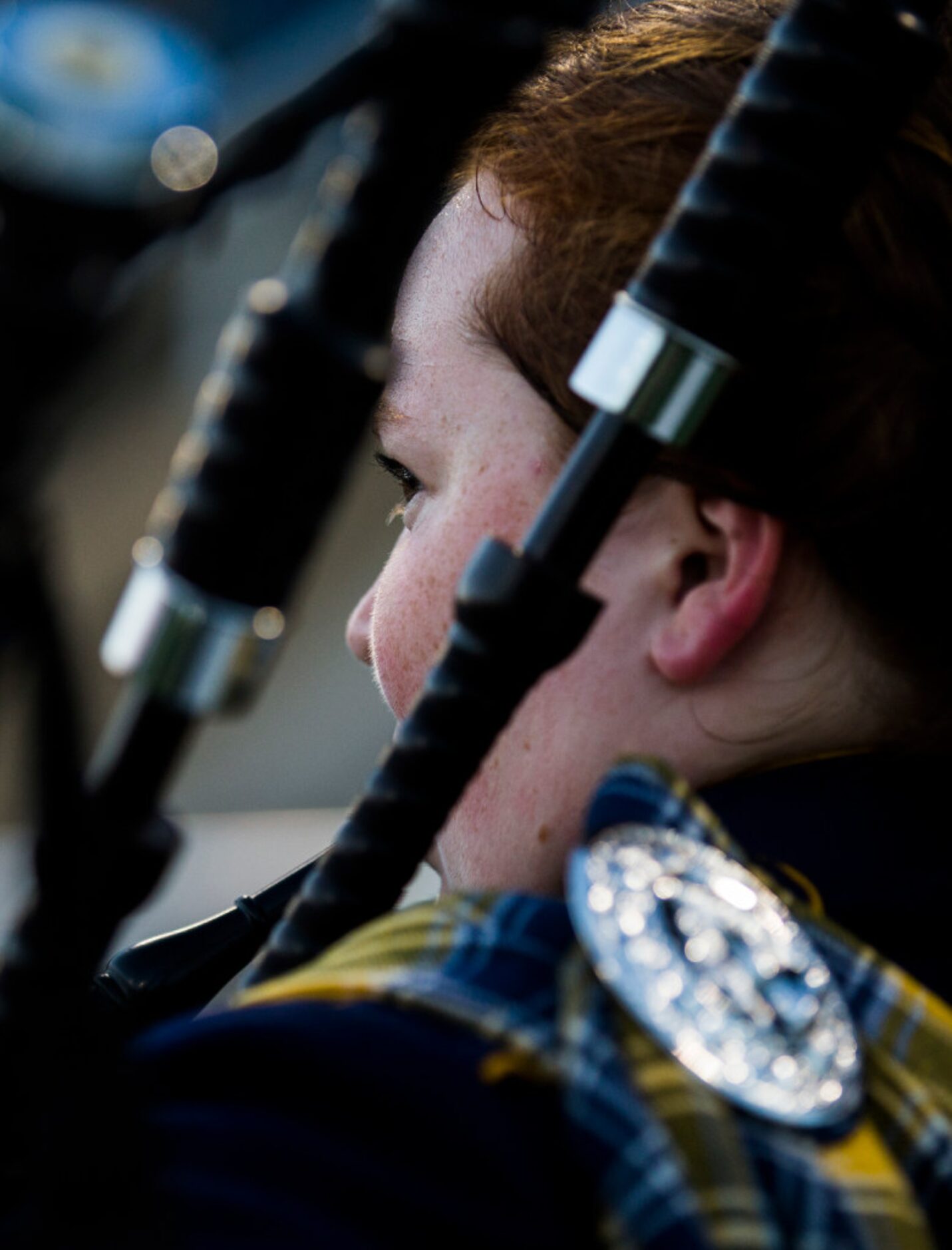 Highland Park junior Julie Herrick, 16, plays the bagpipes before their game against...