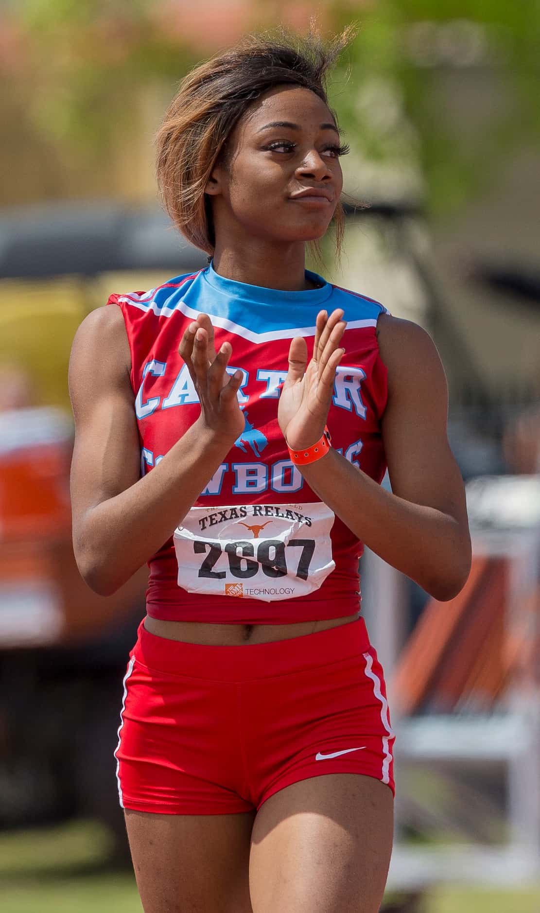 Dallas Carter's Sha'Carri Richardson (2697) celebrates finishing first in the girls Division...