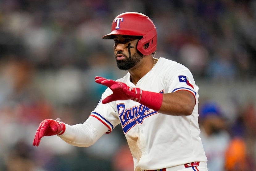 Texas Rangers' Ezequiel Duran reacts after reaching first base on a single against the New...