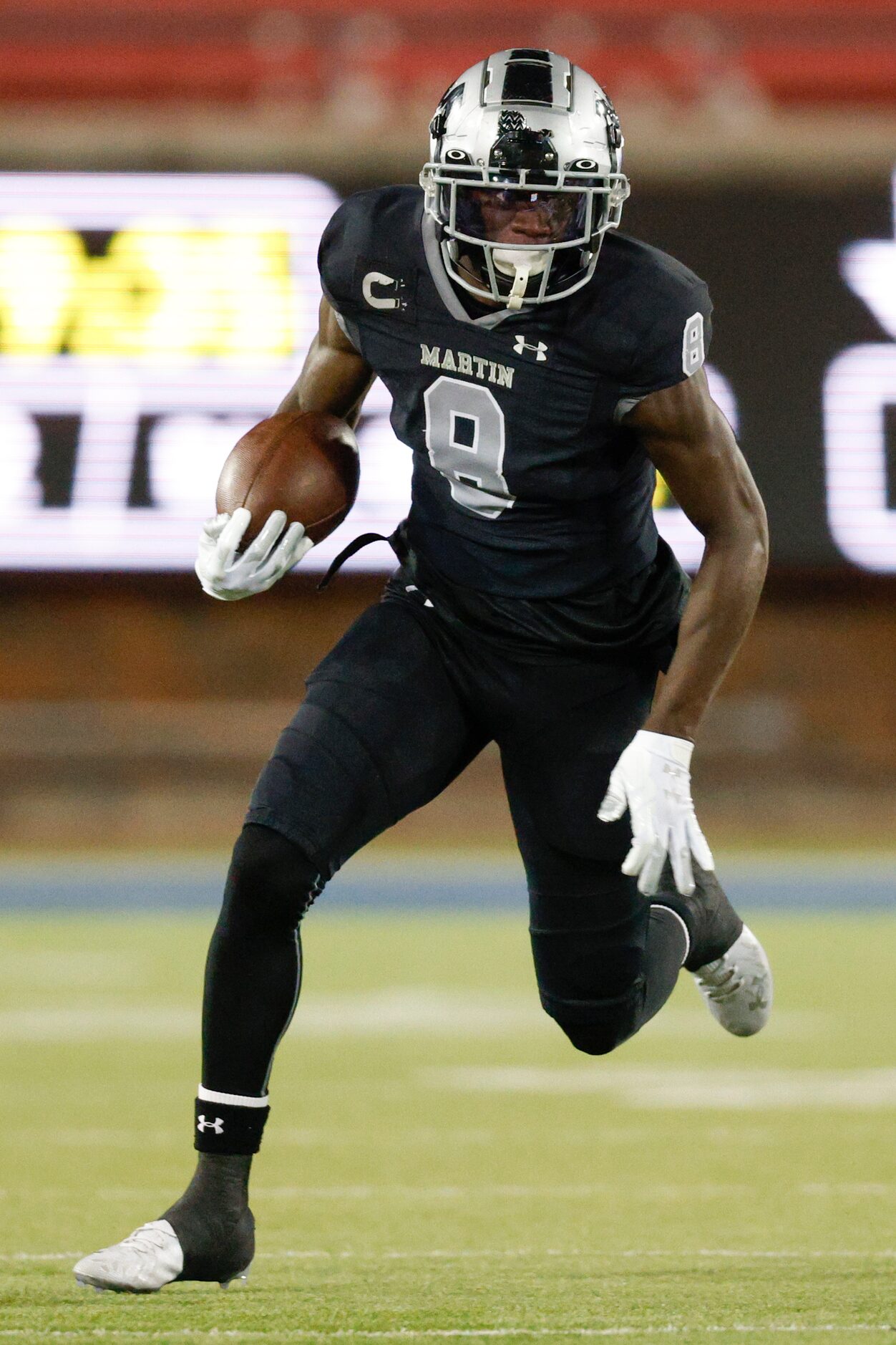 Arlington Martin running back Javien Toviano (8) runs the ball during the first half of a...