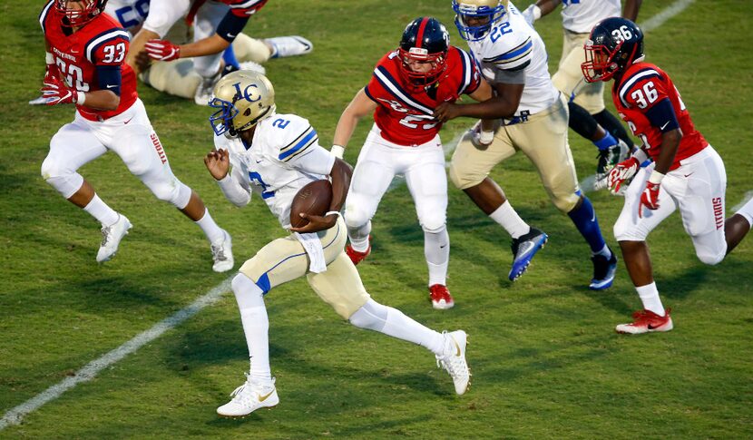 Garland Lakeview quarterback Kamron Fields (2) keeps the ball and breaks away form the...