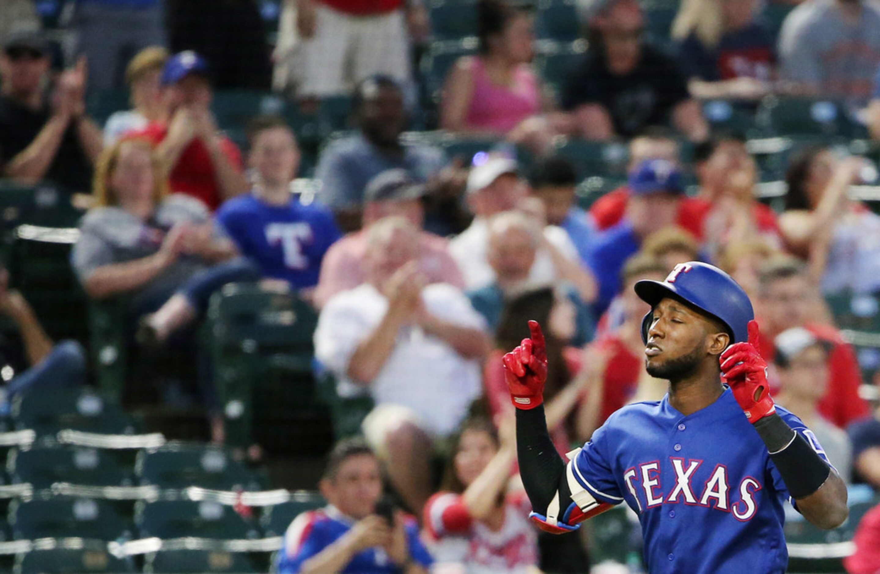 Texas Rangers shortstop Jurickson Profar (19) hits a home run to make the score 1-5 during...