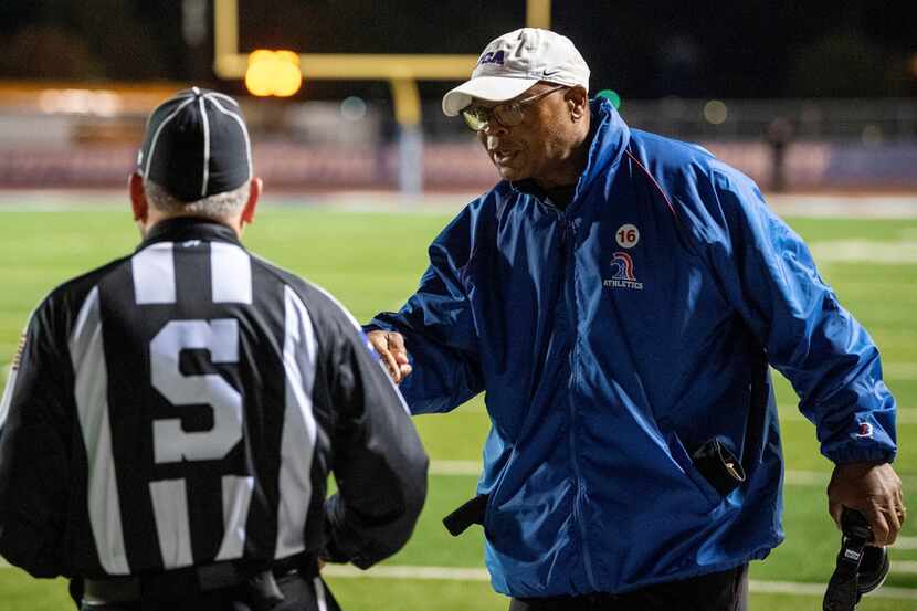 TCA-Addison head coach and NFL Hall of Famer Mike Singletary disputes a call with a referee...
