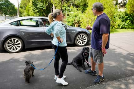 Michael Hoffman gave a thumbs up to his neighbors, who stopped to ask how he and wife Jackie...