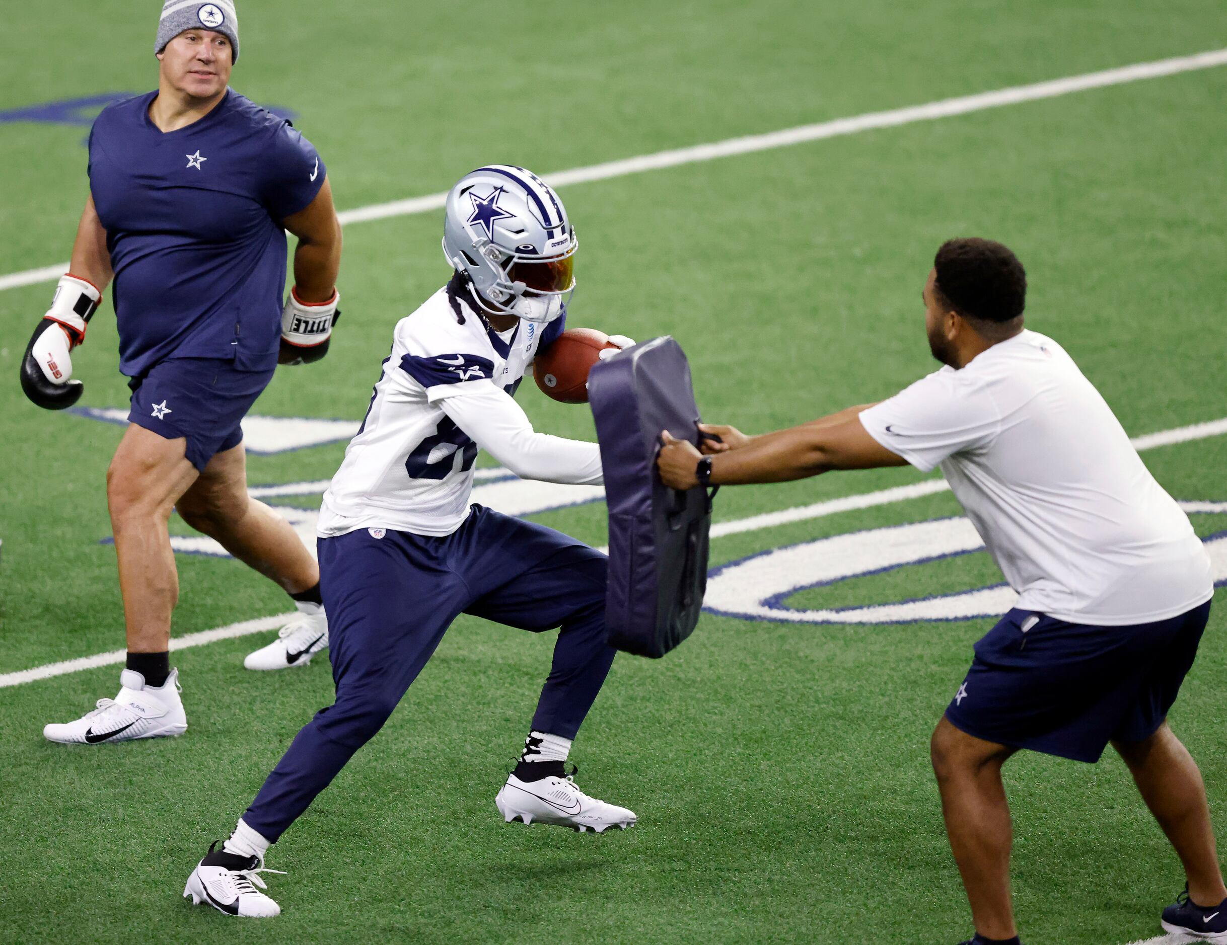 Dallas Cowboys wide receiver CeeDee Lamb (88) runs through a tackling drill during a mini...