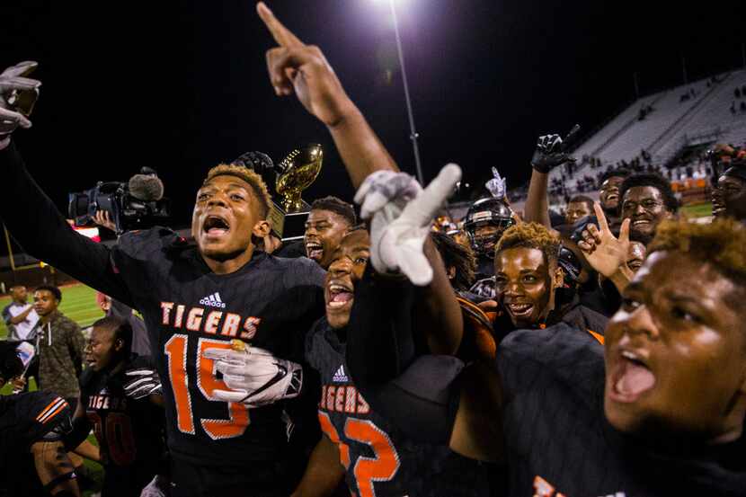 Lancaster celebrates winning 42-35 over Waxahachie to win the District 10 5A championship on...