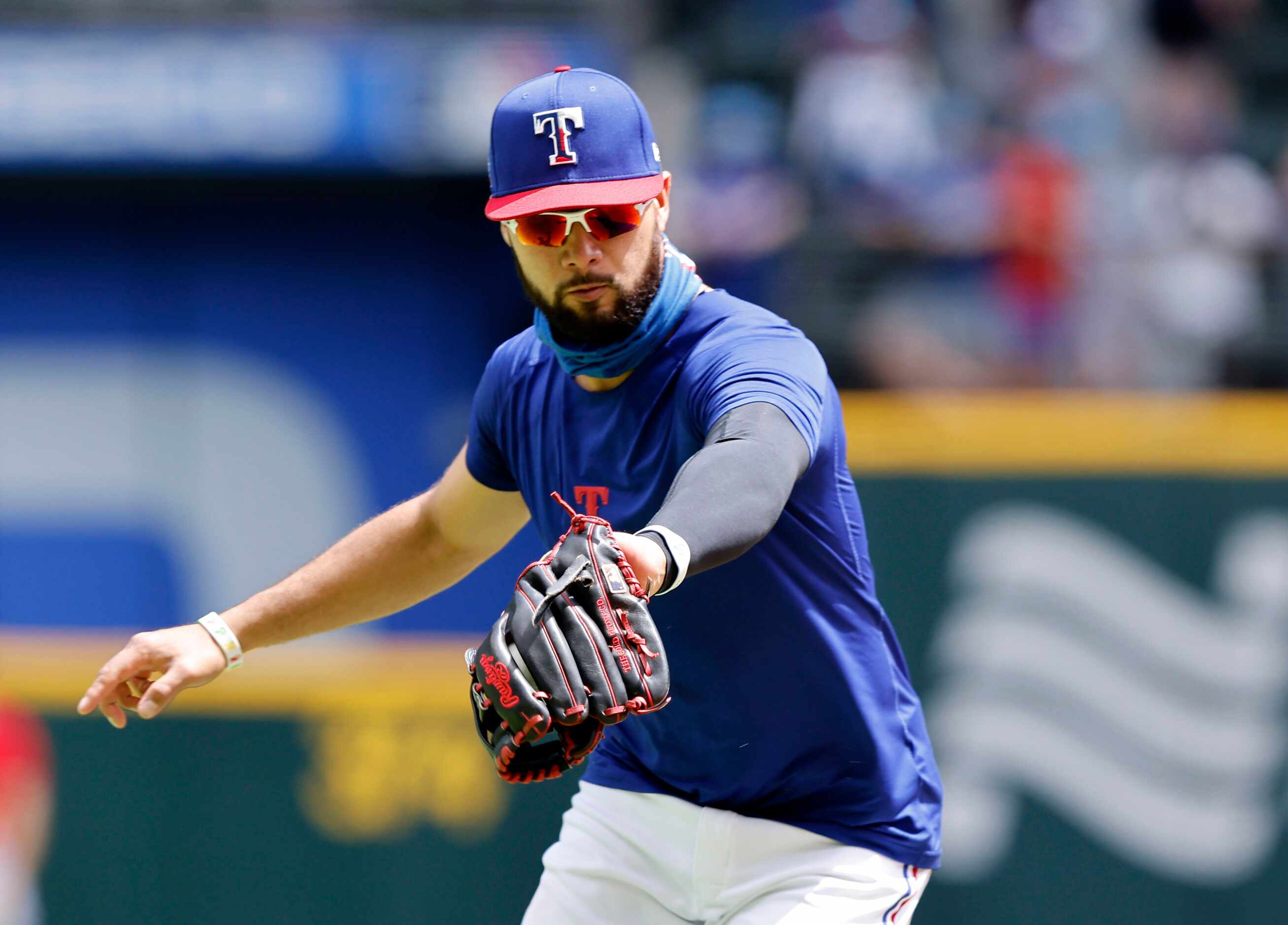 Texas Rangers third baseman Isiah Kiner-Falefa (9) fields a ball during batting practice at...