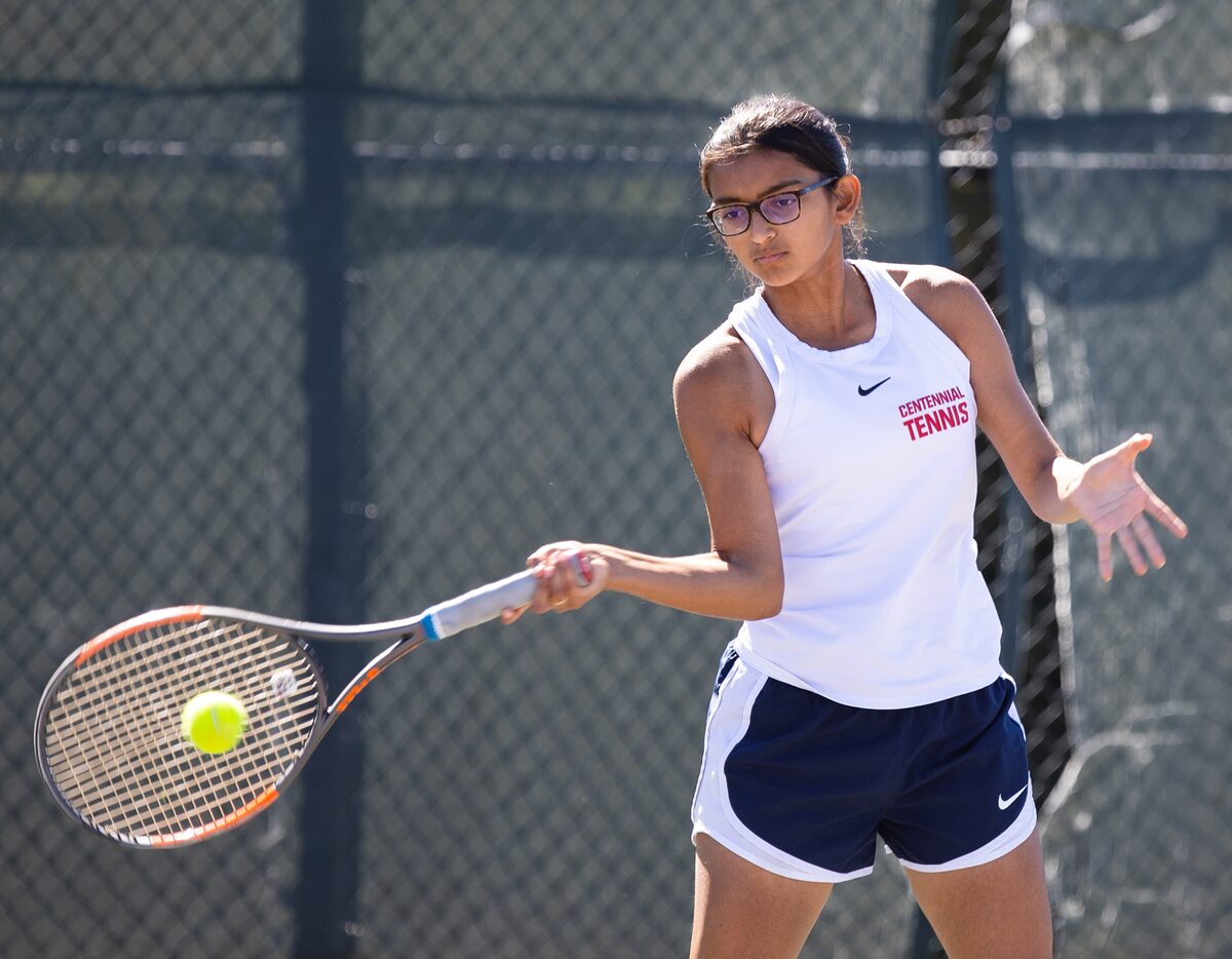 Frisco Centennial’s Akriti Bhati returns a shot during a doubles match with partner Diya...