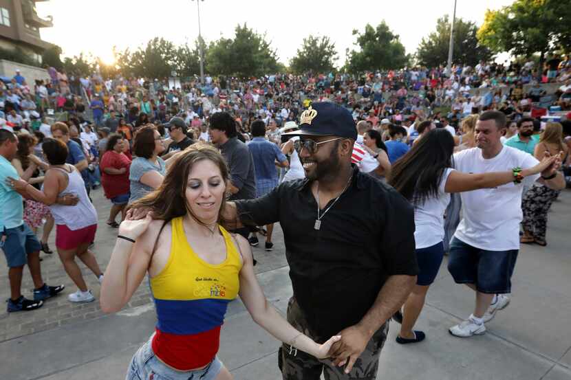Elysia Sonntag, left, and Anthony Young enjoy dancing during the Vitruvian Salsa Festival at...