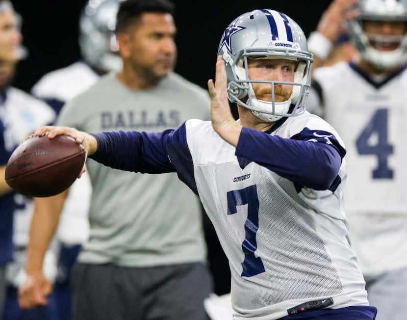 Dallas Cowboys quarterback Cooper Rush (7) throws a pass during a Dallas Cowboys OTA...
