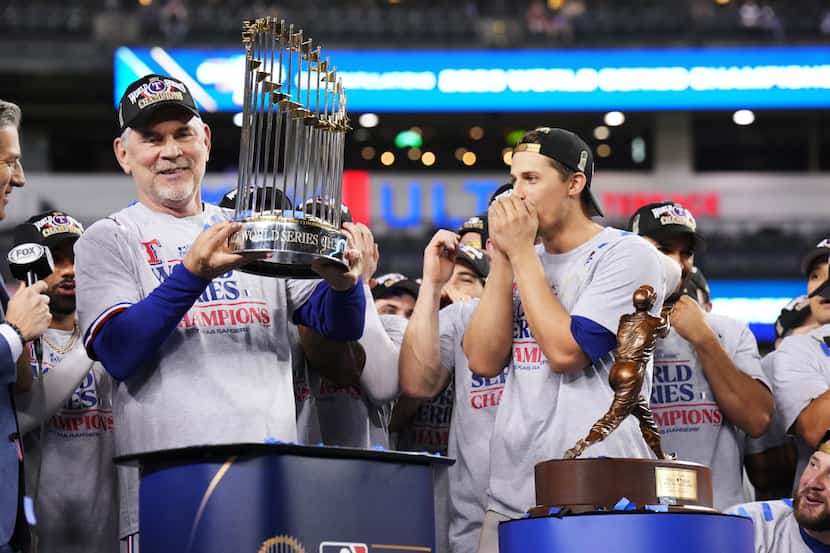 Texas Rangers manager Bruce Bochy, left, celebrates winning the World Series over the...