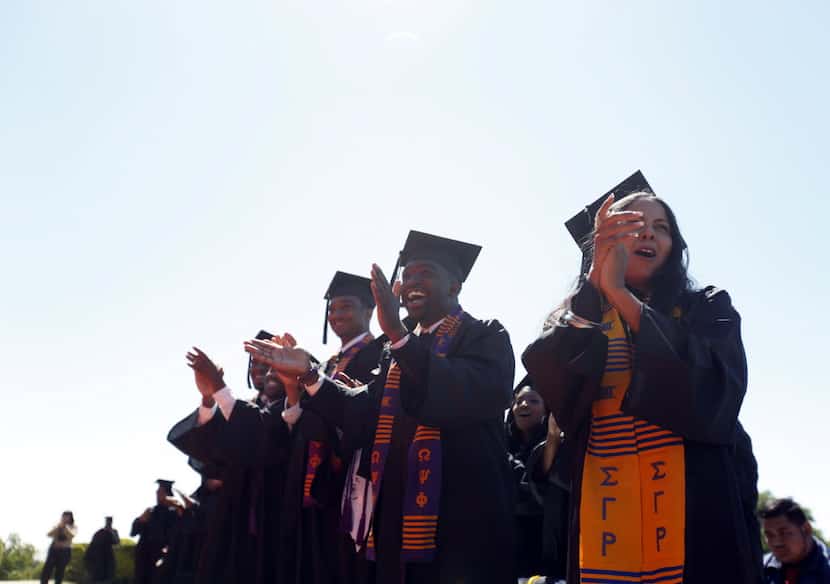 Paul Quinn College graduating students celebrate during a commencement ceremony.