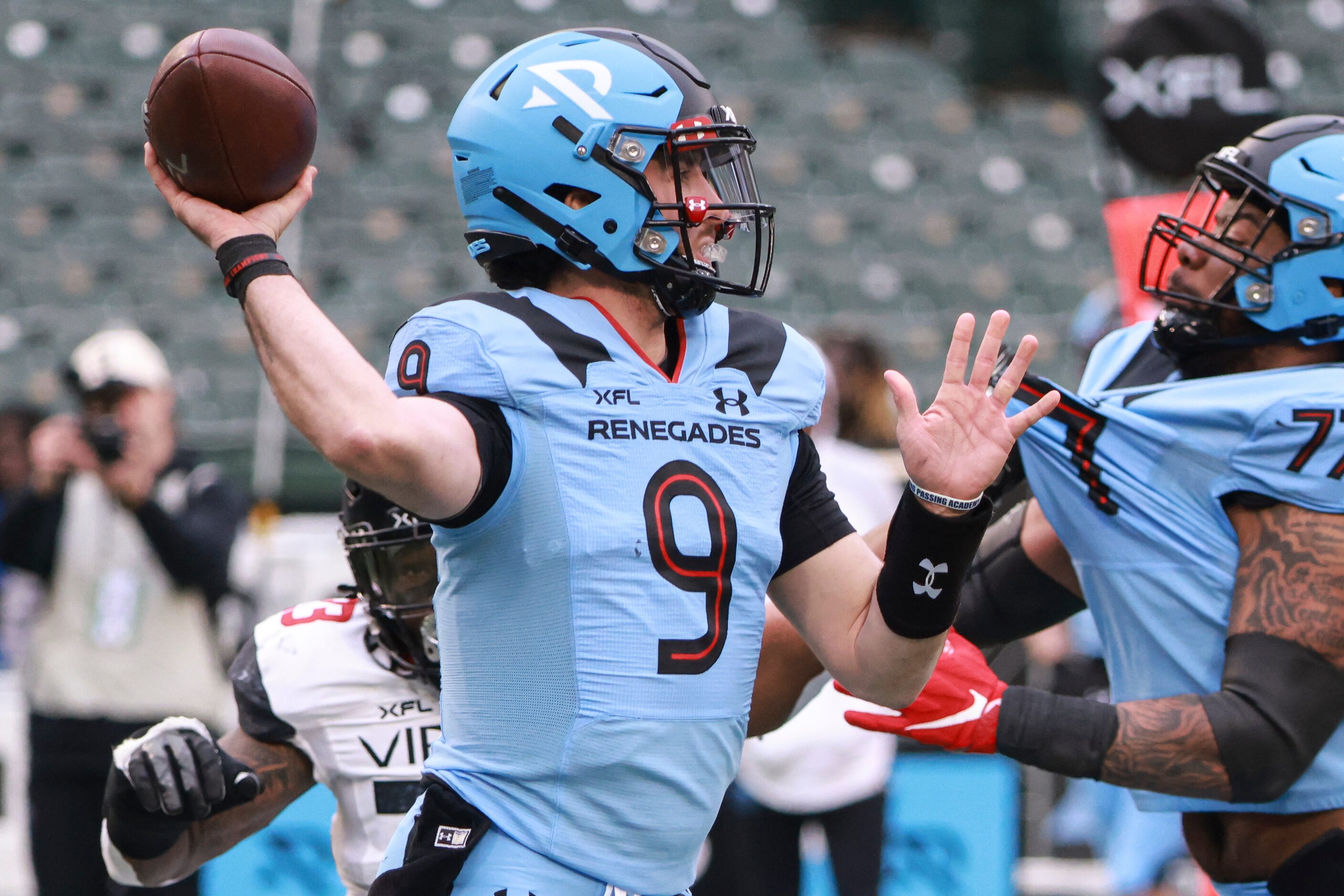 Arlington Renegades Drew Plitt (9) looks to pass during the first half of the XFL football...