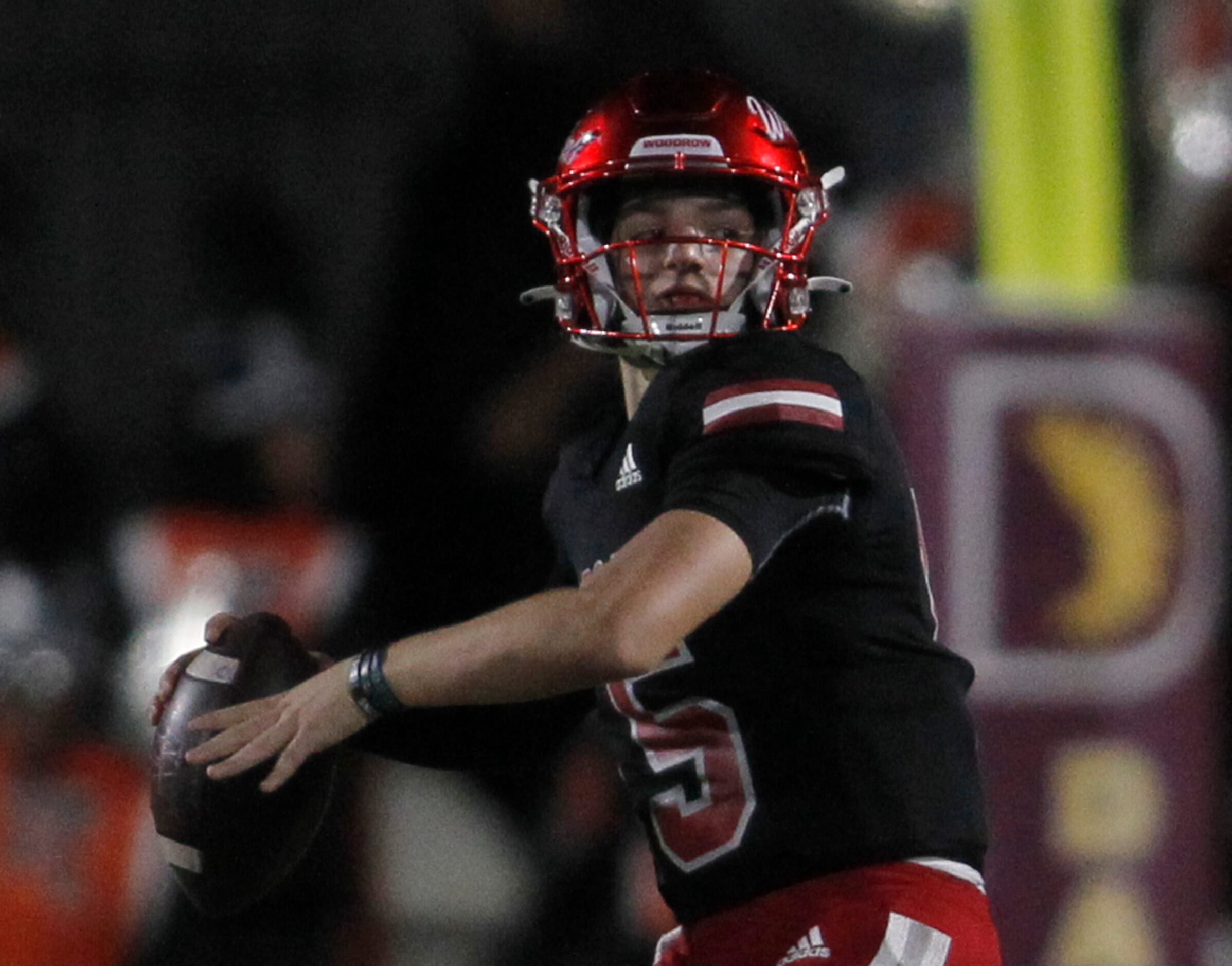 Dallas Woodrow Wilson quarterback Cam McGuire (15) launches a pass during 2nd quarter action...