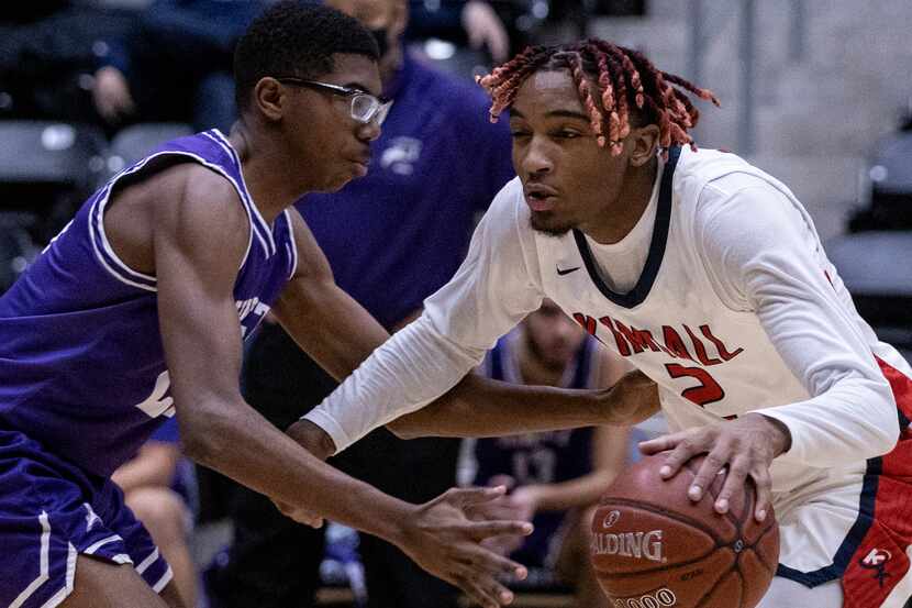 Justin F. Kimball High School Arterio Morris (2) dribbles the ball past Sunset High School...