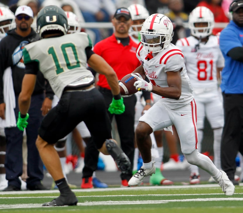 Duncanville receiver Ayson Theus (4), right, tacks on yardage after a reception as DeSoto...