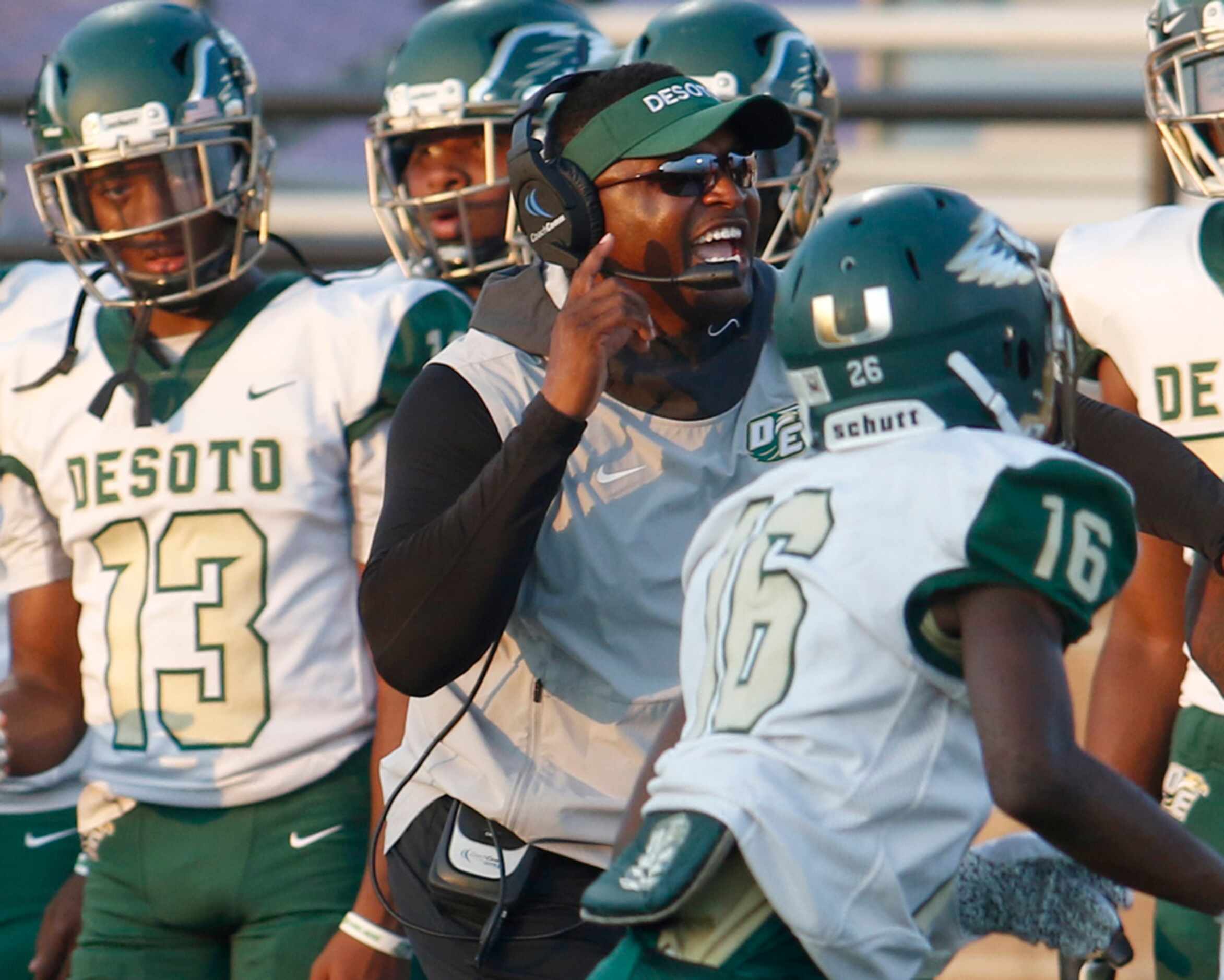 DeSoto head coach Claude Mathis reacts on the team sideline during a first half offensive...