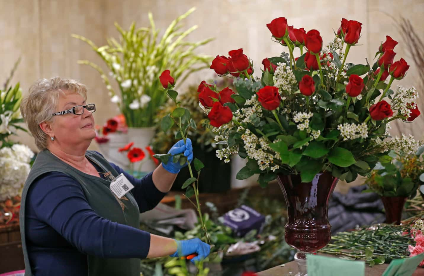 Designer Irina Kraskin worked on an arrangement at McShan Florist in Dallas on Feb. 12, 2018.