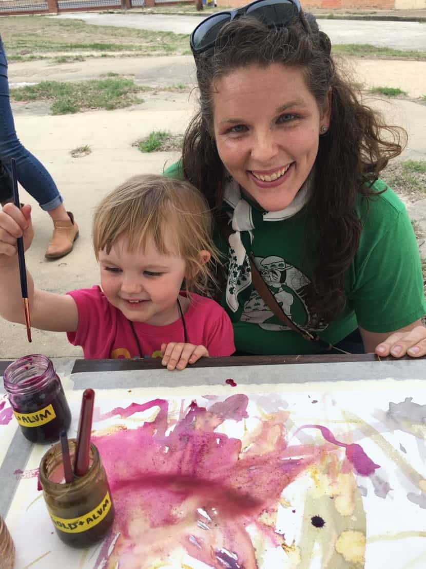 Kara Wigzell, 2, and her mother, Katie O'Brien, of Dallas paint with natural dyes.