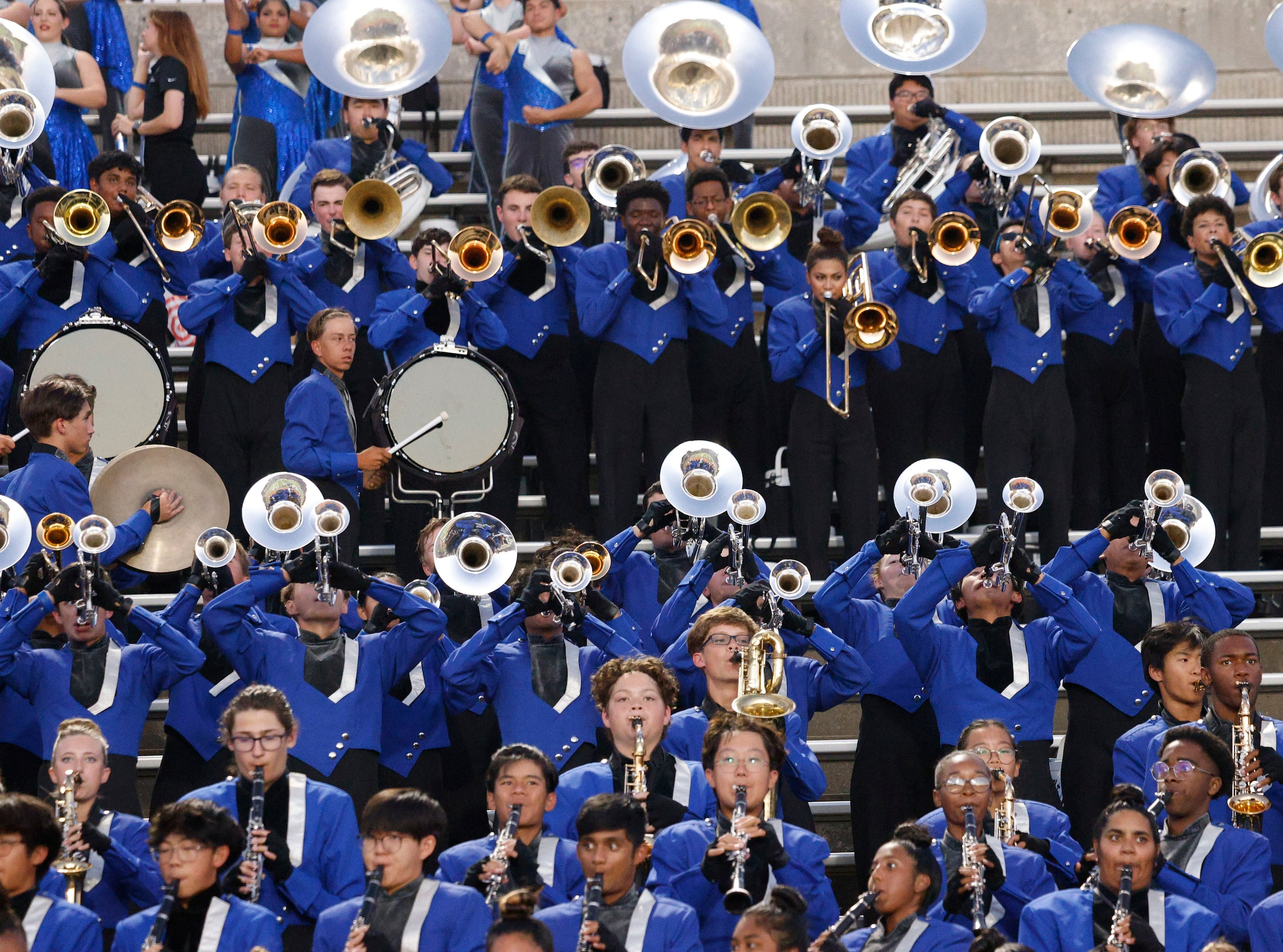 Hebron’s marching band members perform in the first half of a high school football game...