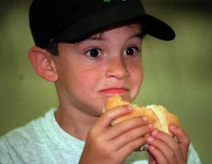 Jordon Mier, 7, gets a surprised  look upon tasting the special sauce in the McDonalds Arch...