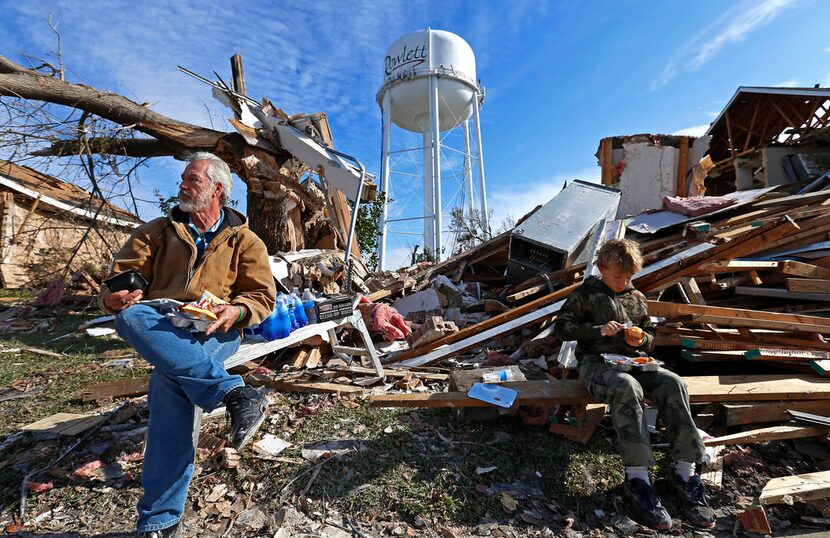 Homeowner Gary Hale (left) took a lunch break with his grandson Gabriel Hale while cleaning...