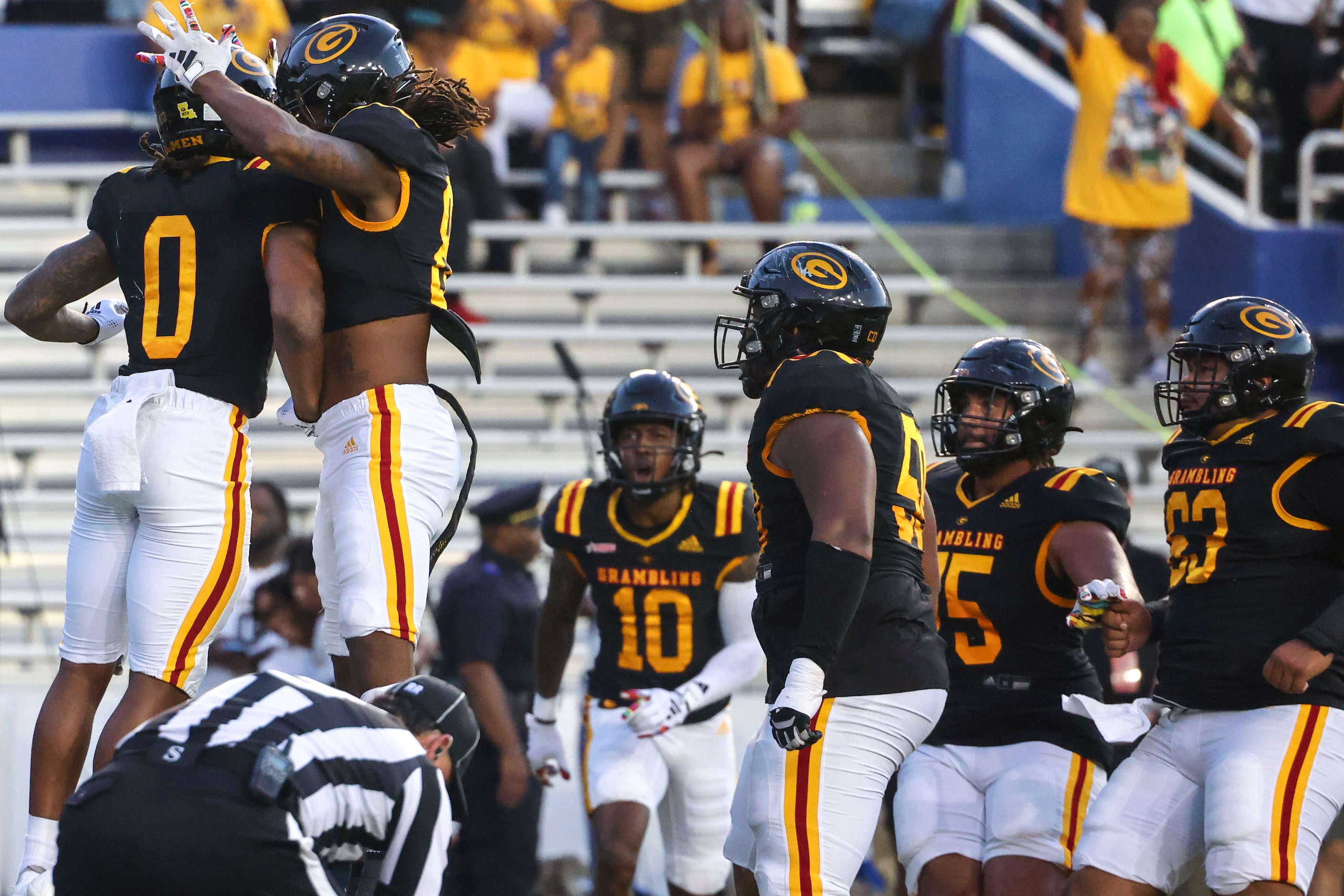 Grambling State players celebrate a touchdown during the first half of State Fair Classic...