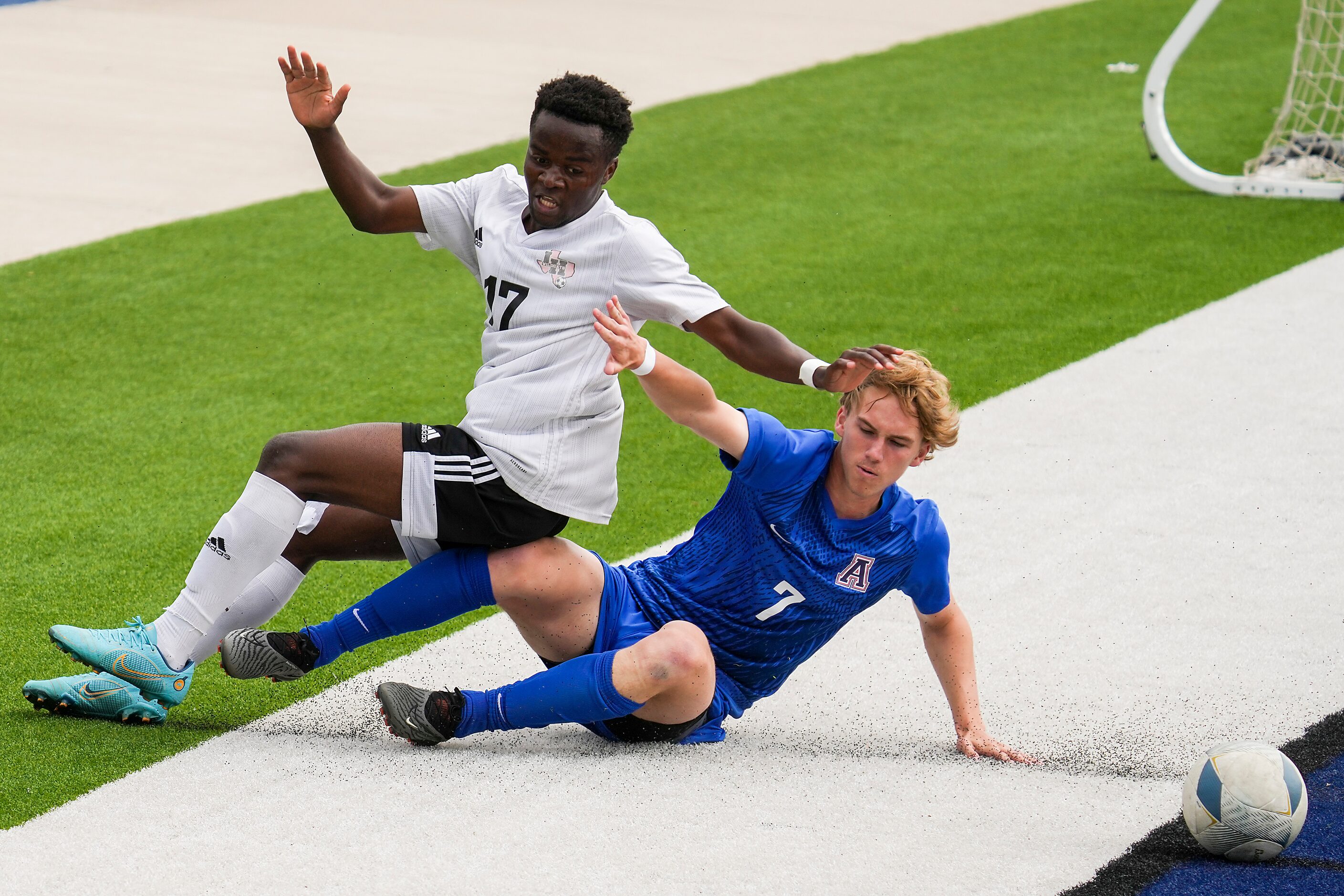 Allen defender Dylan Berry (7) slide across the end line as he fights for the ball against...