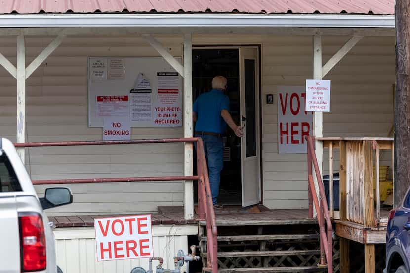 A voter enters Tuscaloosa County Ward 5, Montgomery Fire Department, to vote during a...