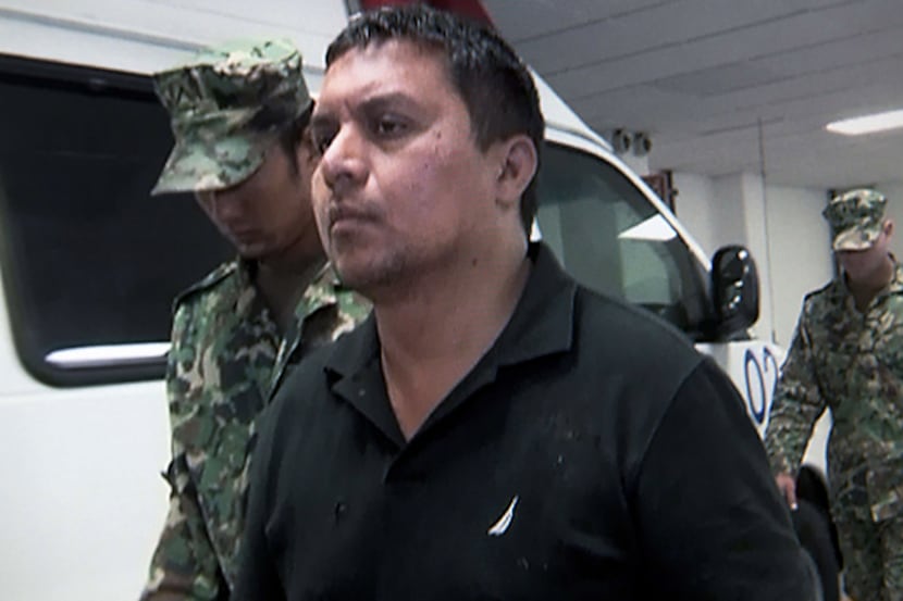 Reputed Zetas cartel leader Miguel Angel Trevino Morales, aka "El Z 40,"  is escorted by...
