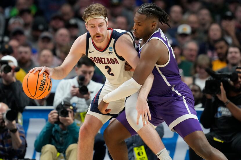 Gonzaga forward Drew Timme, left, looks to move the ball as Grand Canyon forward Yvan...