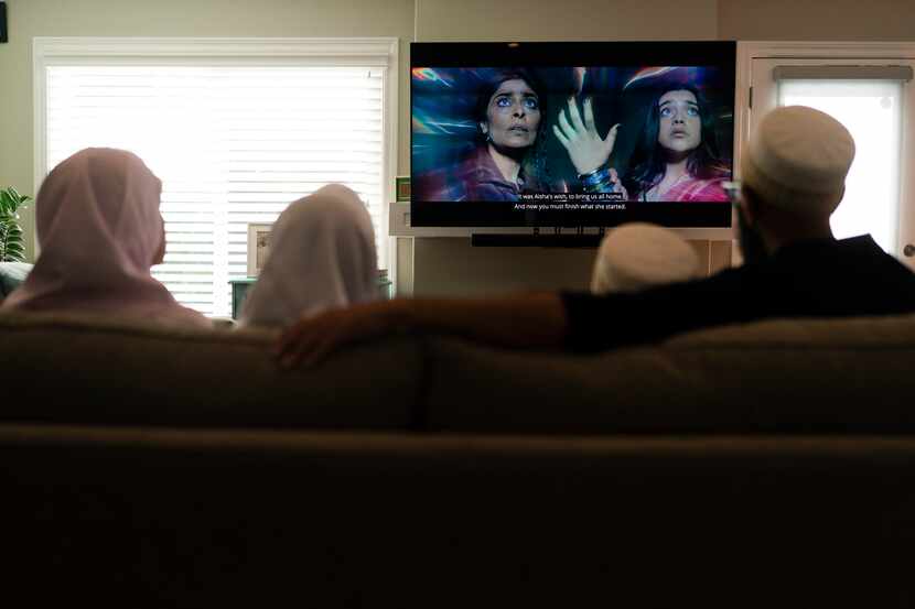 The Zakir family watch an episode of "Ms. Marvel" in Anaheim, Calif.. The new series on...
