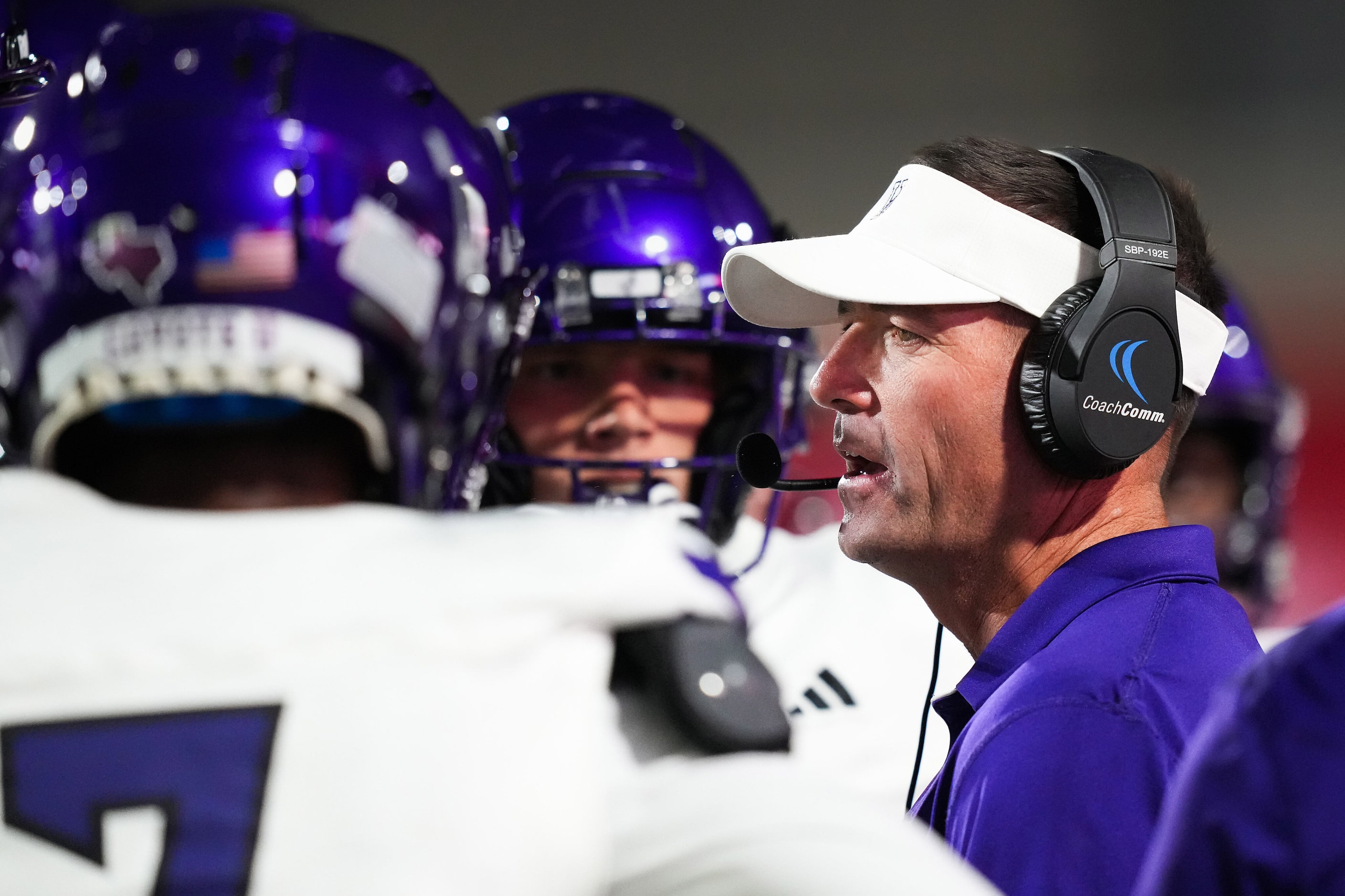 Anna head coach Seth Parr huddles with his players during the first half of a District 4-5A...