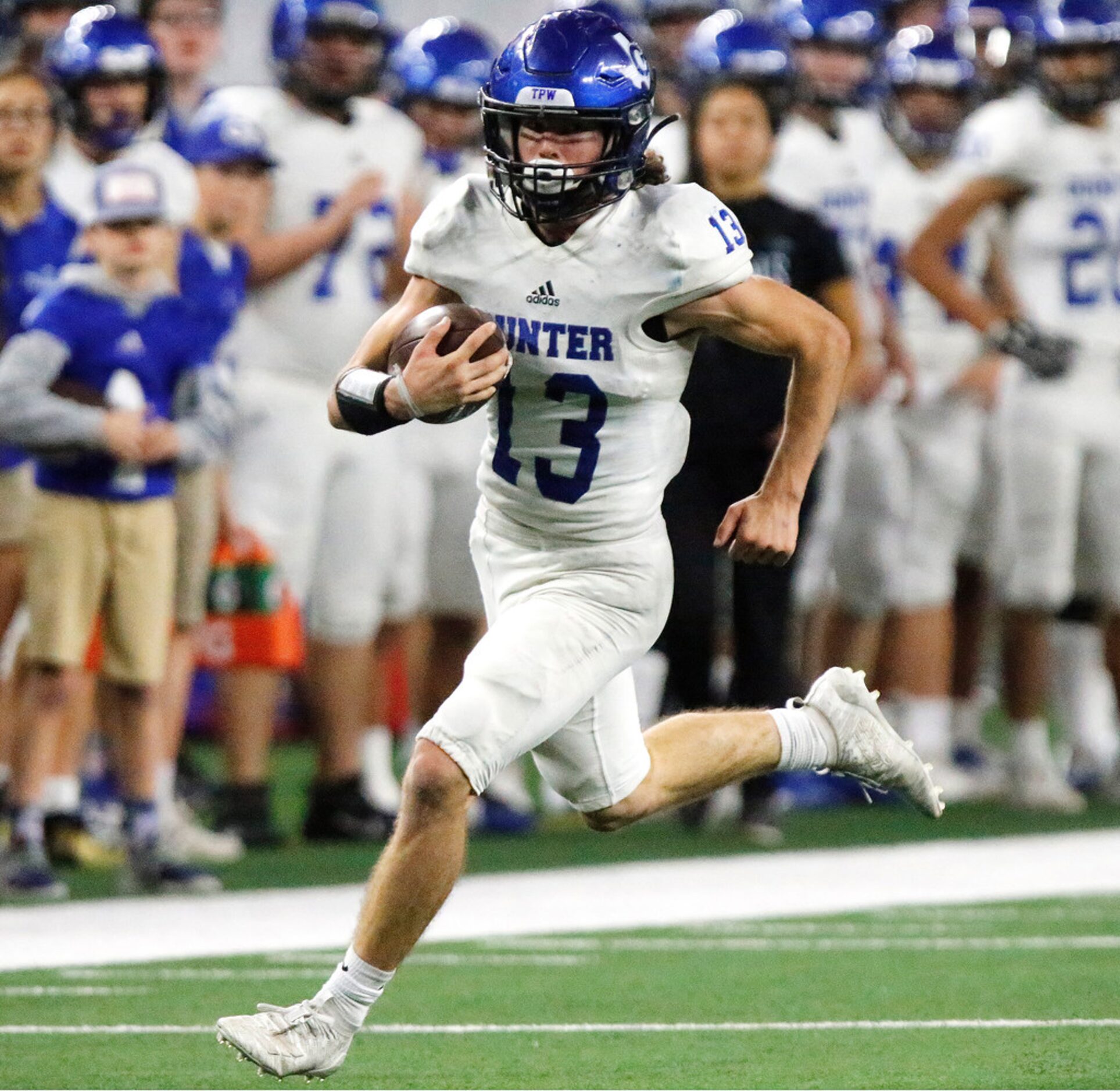 Gunter High School wide receiver Clayton Reed (13) runs for a big gain during the second...