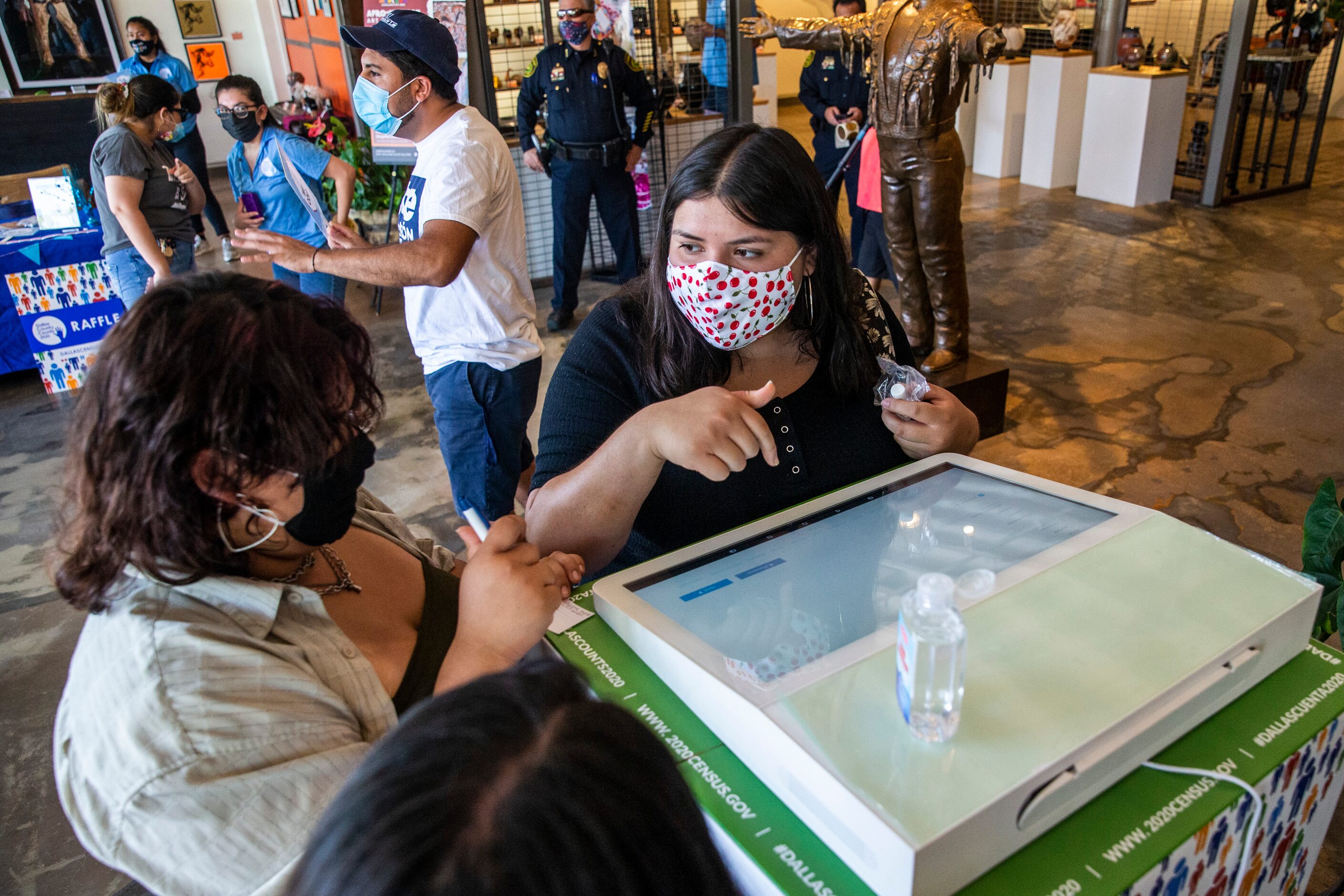 Sisters Luzette Portillo (right) and Lilly Flores (left) fill out the U.S. Census during the...