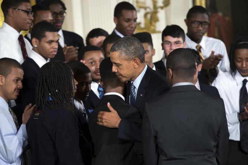 President Barack Obama hugs a student during an event in the East Room of the White House...