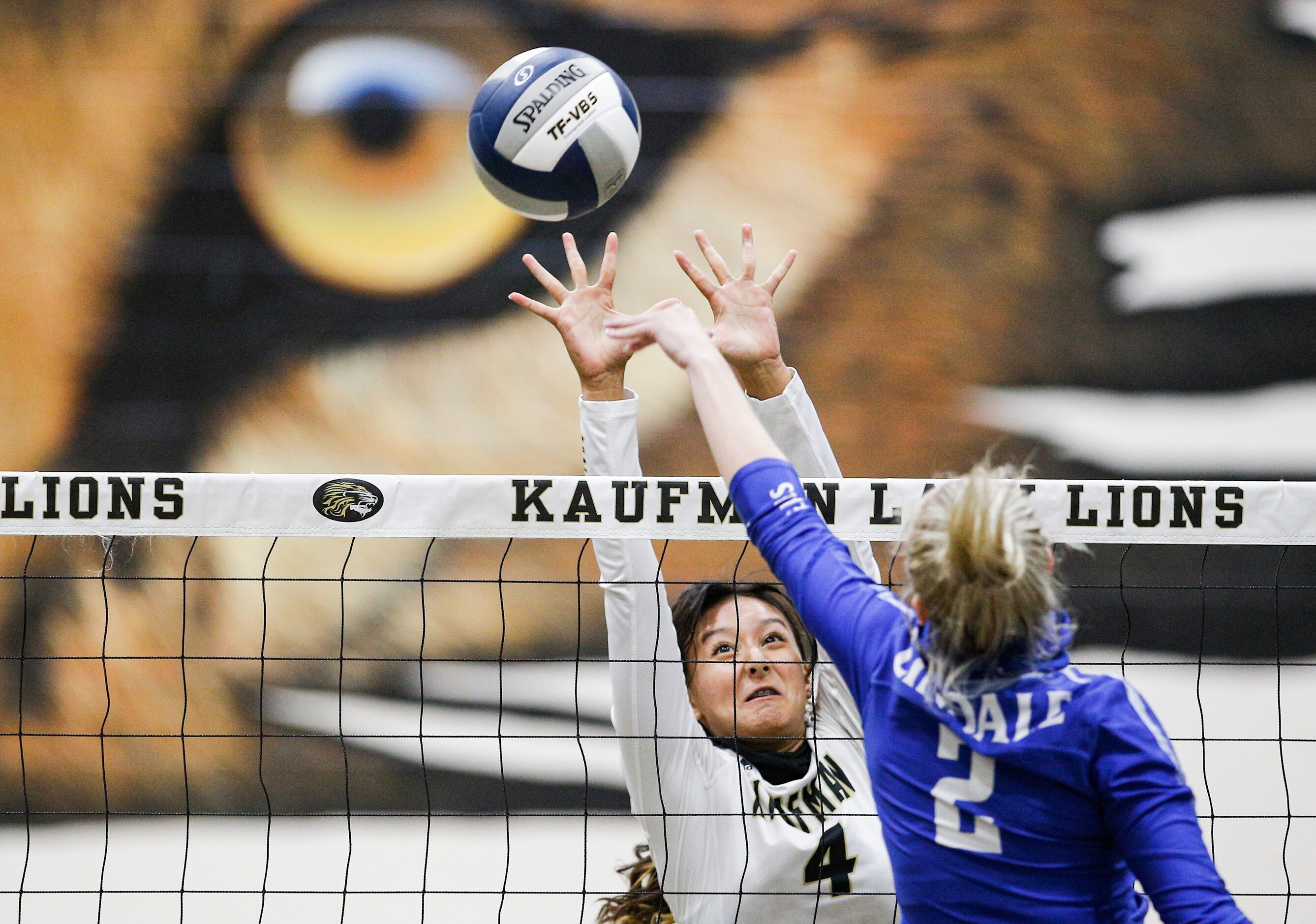 LindaleÕs Skylar Wyllie spikes the ball as KaufmanÕs Evelyn Ramos (4) defends during a high...