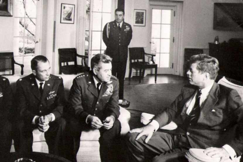 President John F. Kennedy meets with Air Force Maj. Richard "Steve'' Heyser, left, and Air...